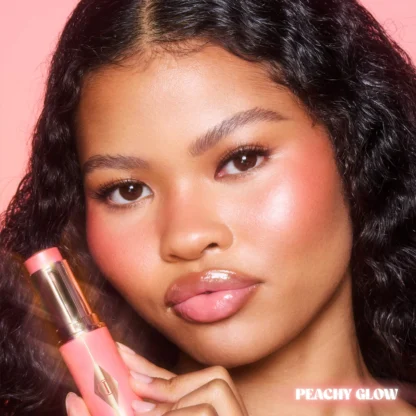 Charlotte Tilbury  Unreal Lip + Cheek Glow Blush Stick with Hyaluronic Acid - Imagen 18